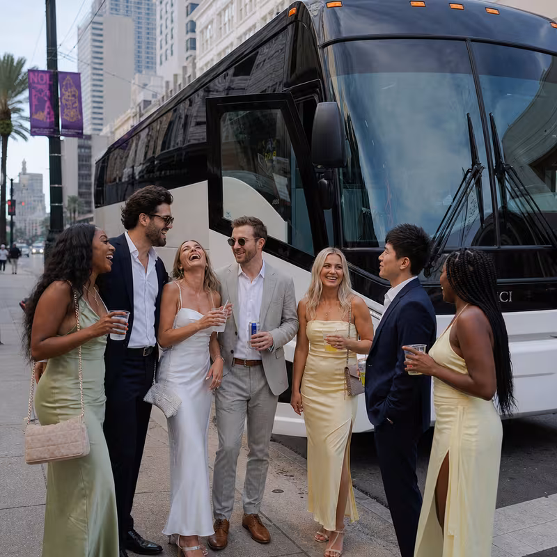 Passengers loading luggage while boarding an New Orleans group shuttle