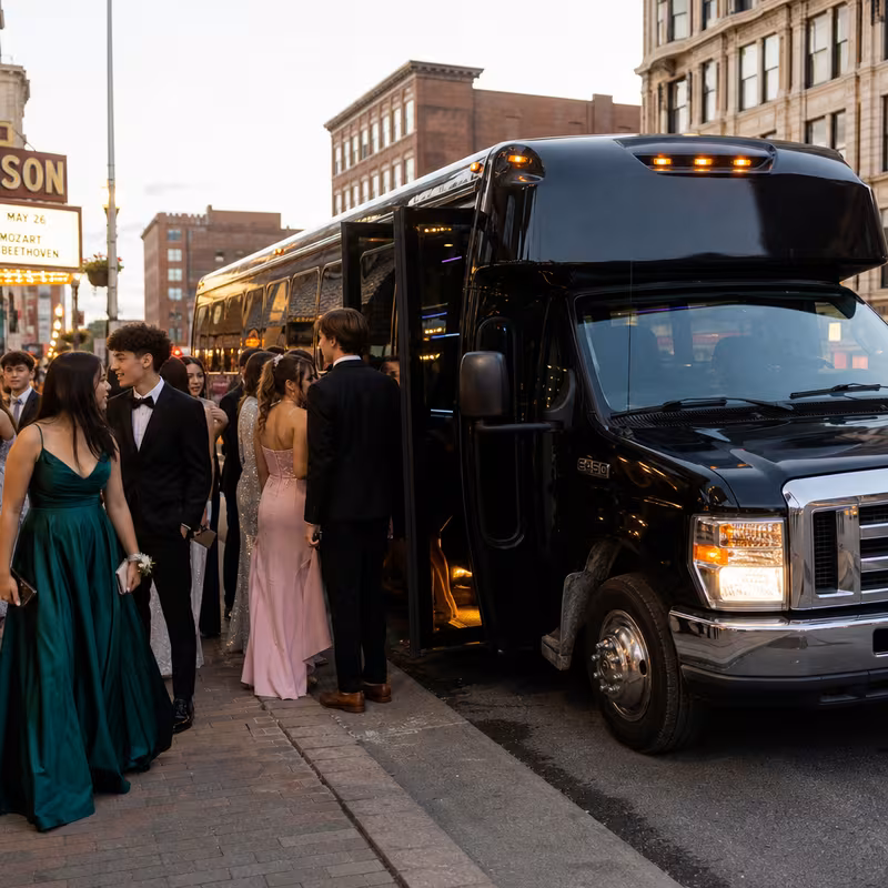 Passengers loading luggage while boarding an New Orleans group shuttle