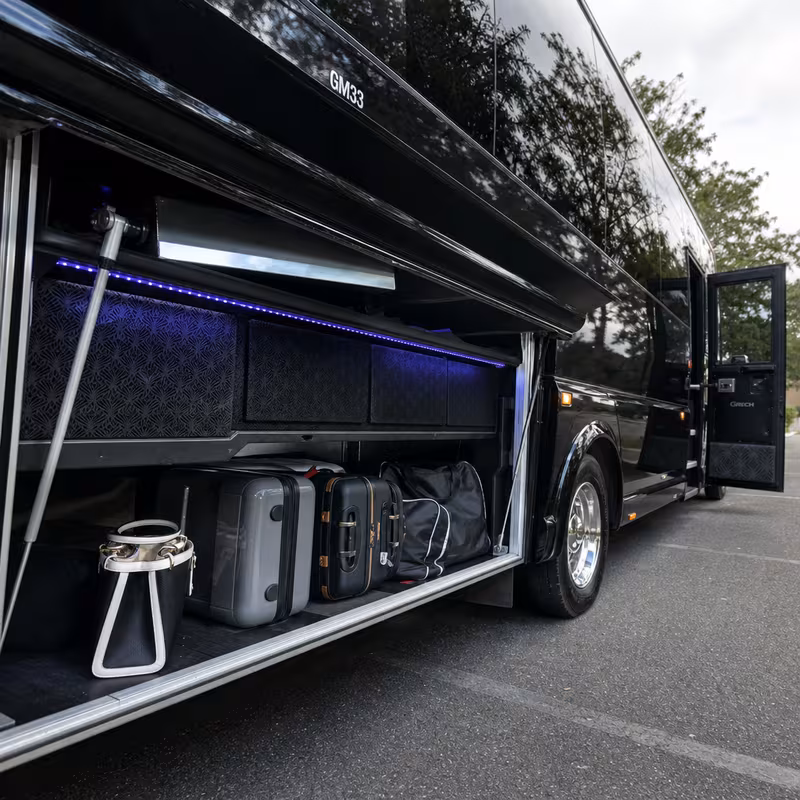Party bus interior with wraparound leather seating and LED lighting in New Orleans