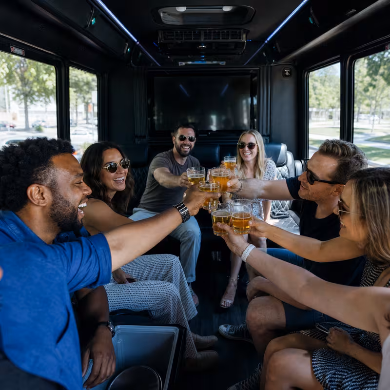 Group boarding a white charter bus for Winery & Brewery Tour Transportation transportation in New Orleans