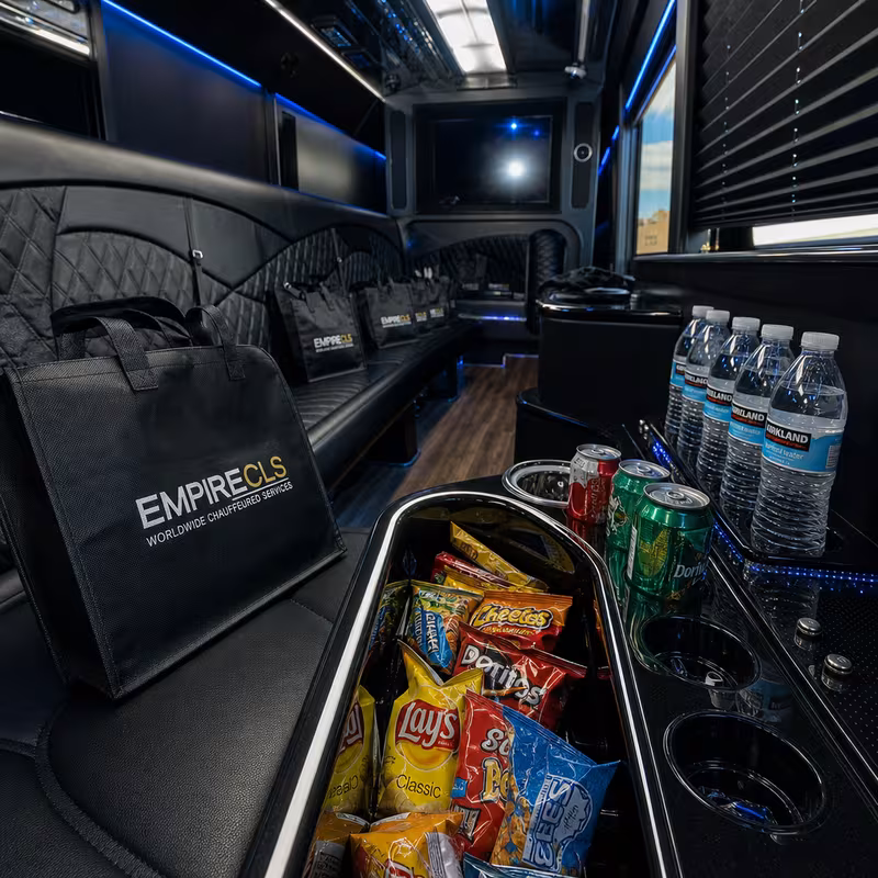 Party bus interior with wraparound leather seating and LED lighting in New Orleans